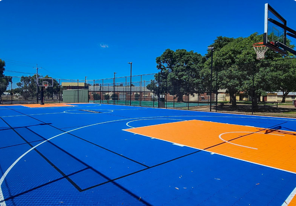 Photo of the outdoor rainbow basketball court